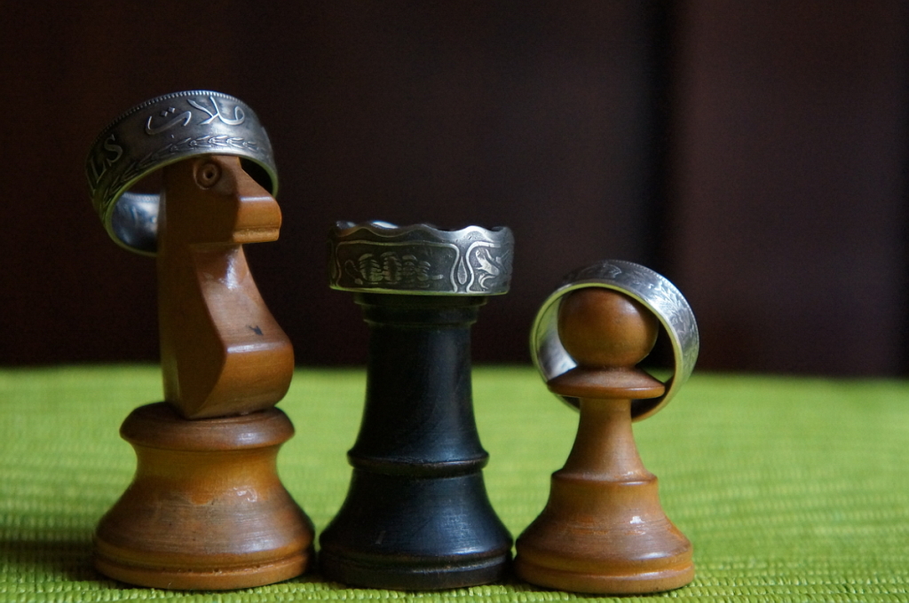 Three amigos wearing coin rings.