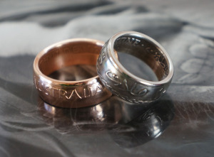 Mirror polish finish on the Australian penny copper ring with reflection.