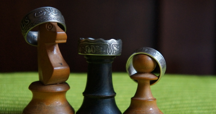 Three Amigos wearing coin rings